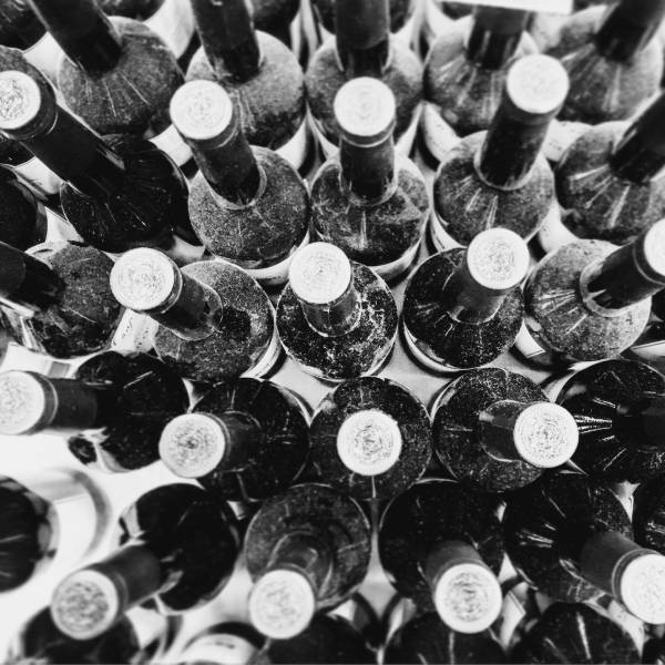 Bunch of balck and white bottles in an image